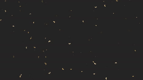 Flying-gold-confetti-on-black-gradient