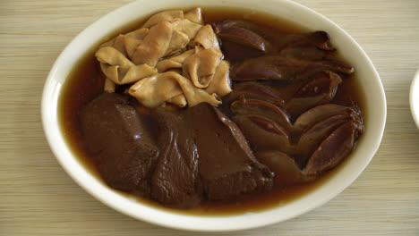 stewed duck offal in brown soup - asian food style