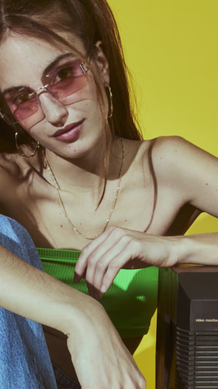 Woman with sunglasses promoting a new fashion arrival with up to 50% off