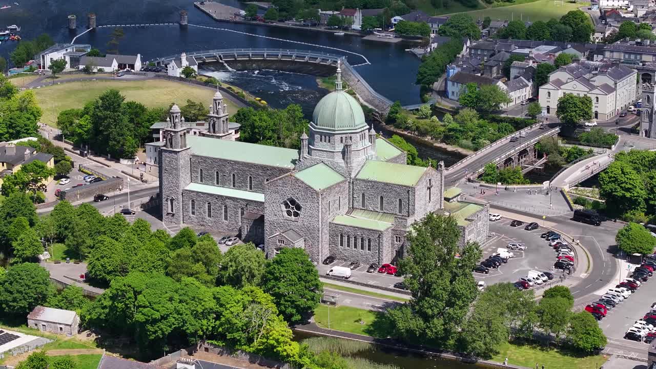 Aerial pull out from Galway Cathedral on Corrib river, West Coast of Ireland. Religious structure.