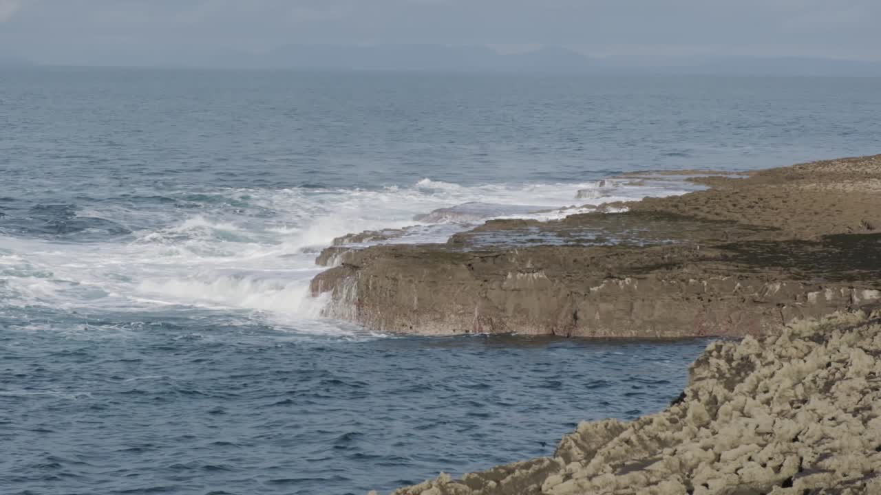 Dramatic Waves Crashing on Rocky Coast