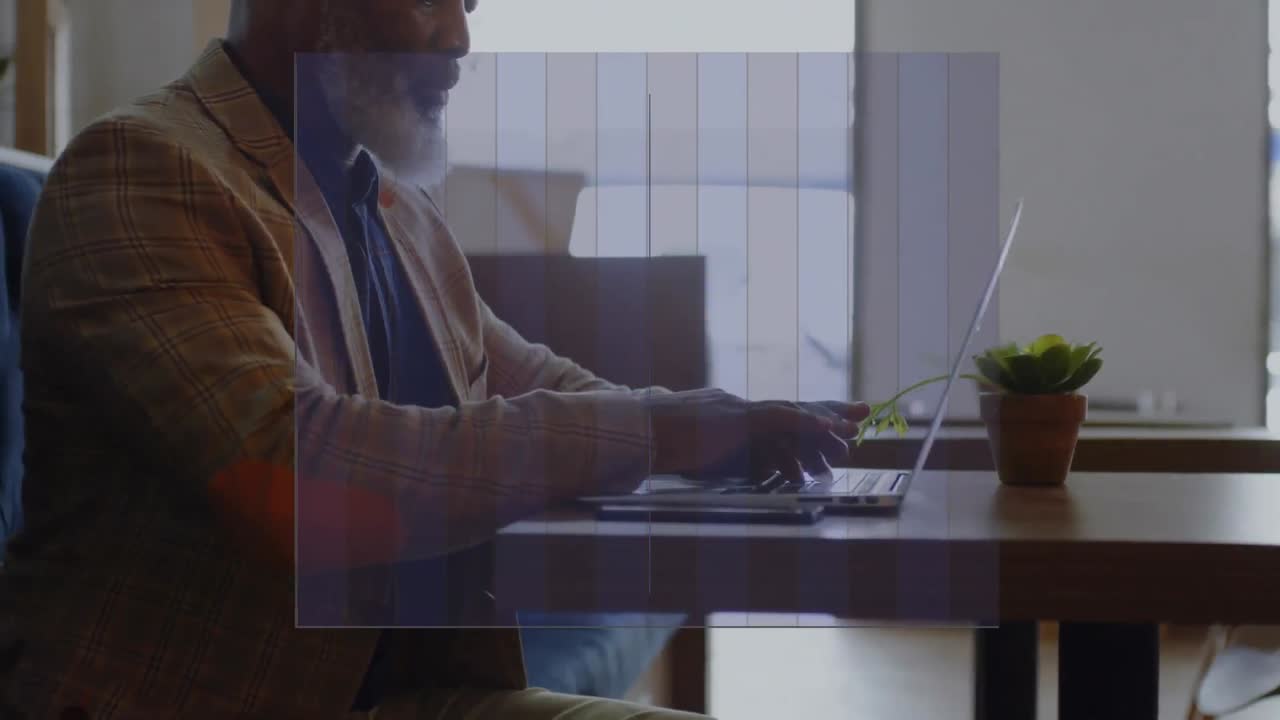 Animation of data processing over african american businessman using laptop
