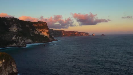 Aerial-view-of-cliff-coastline-of-Nusa-penida-island,-one-of-the-tourist-attractions-of-Bali-island-Crystal-beach-kelingking-beach-angle-billabong-broken-beach