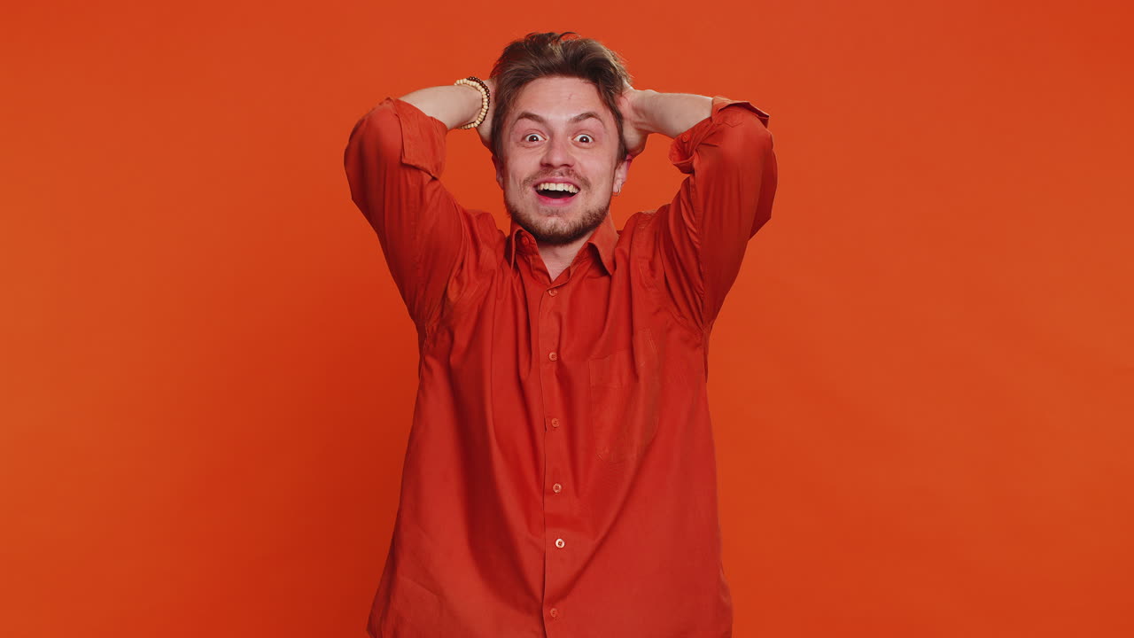 Excited amazed man surprise looking at camera with big eyes shocked by sudden victory wow emotion