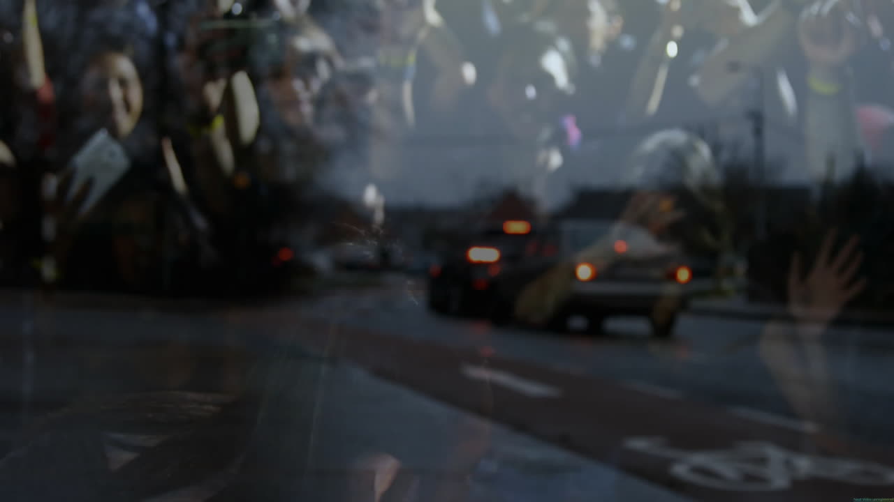 Backpack-wearing person walking through wet urban street glass, showing floating tech data nodes