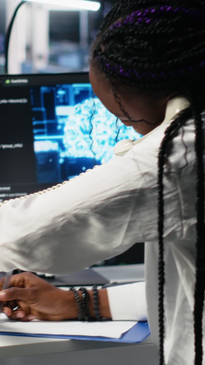 Vertical video Data center admin receiving phone call, using AI assistant for tech support