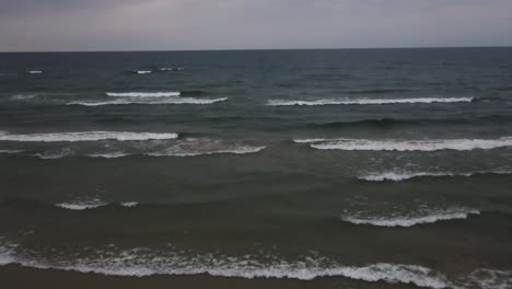 Cresting-storm-waves-lapping-on-the-shore