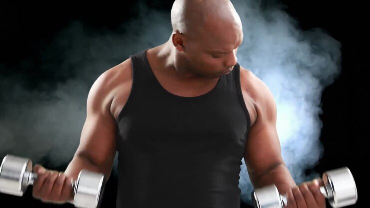 Bodybuilder lifting dumbbells