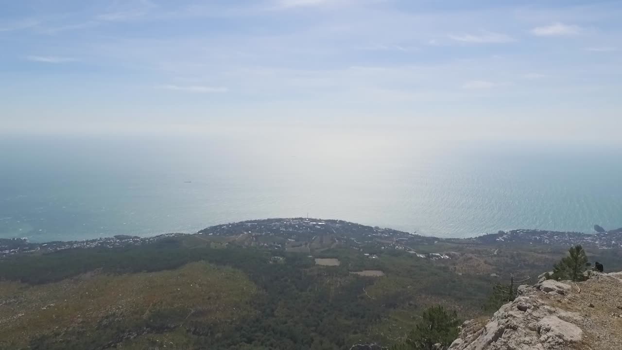 Mountaintop View of Coastal Town and Sea