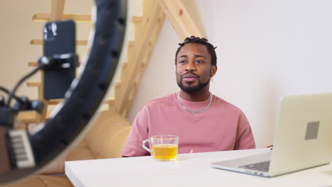 man recording a video or live stream at home.