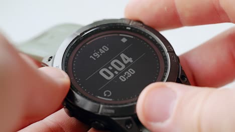 close up of nervous man awaiting 15 sec countdown on adventure watch 19:40