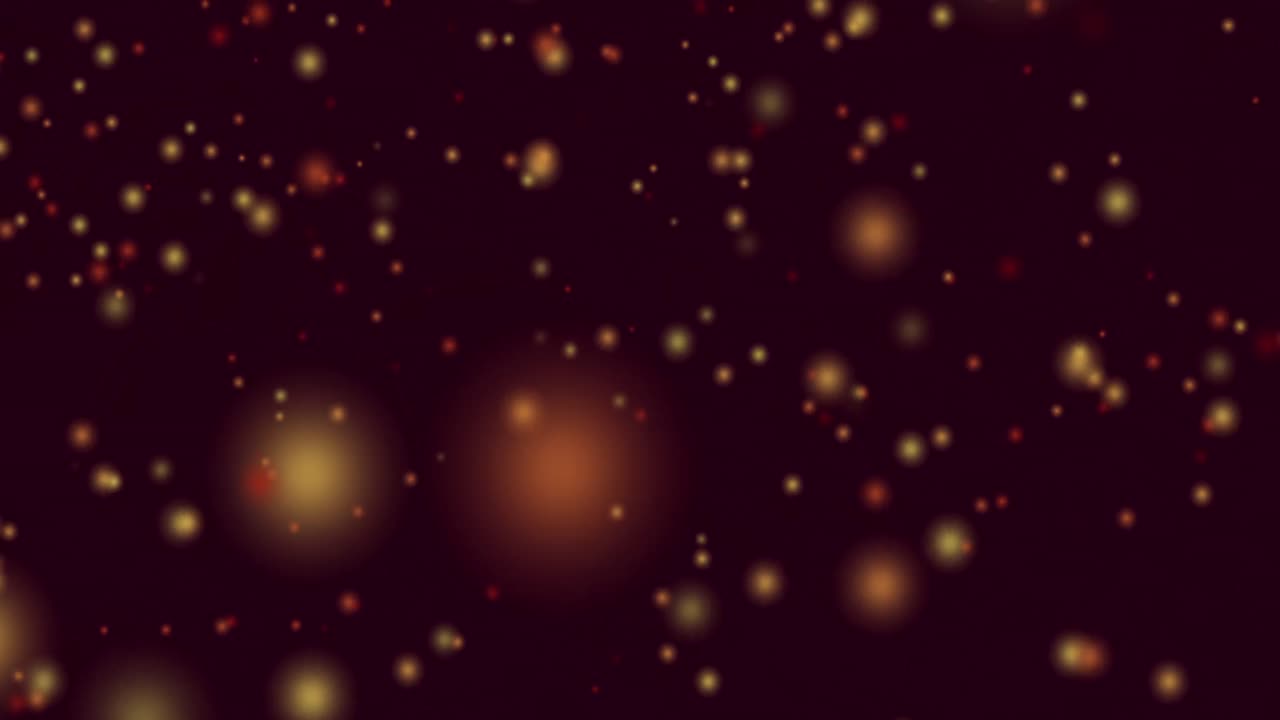 animazione di macchie di luce gialle e rosse che volano in movimento ipnotico su sfondo nero