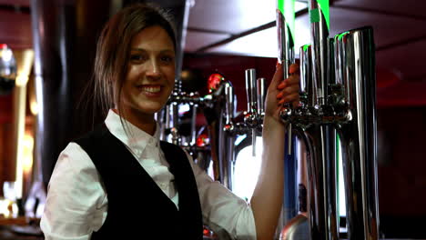 barkeeper checking the beer pumps