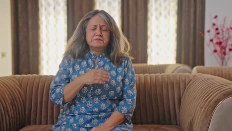 Aged-Indian-woman-suffering-from-cold-and-cough