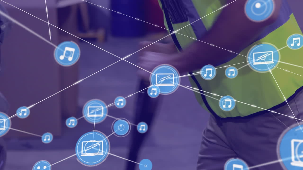 red de iconos digitales contra la sección media del trabajador masculino que usa paleta en el almacén