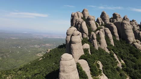 Aerial-views-of-Montserrat-peaks,-a-mountain-range-in-Catalonia