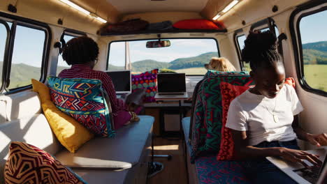 people working inside a van