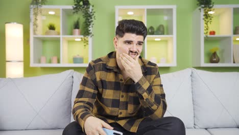 Stressed-and-nervous-man-holding-phone.