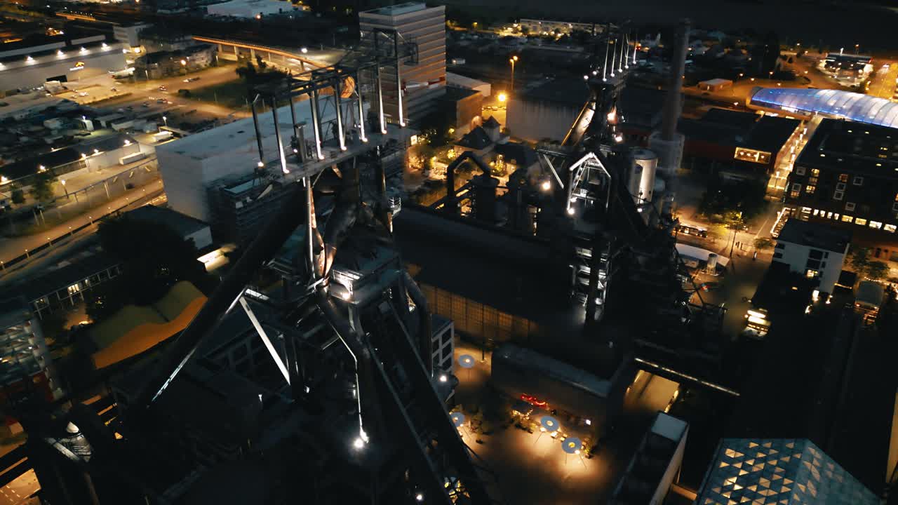 Drone footage of Belval in Luxembourg showing the old blast furnaces at night