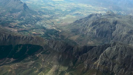 aerial drone shot of mountain ranges from a plane