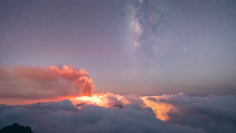 night time lapse of milky way and sea of clouds in la palma island during volcano eruption in september 2021