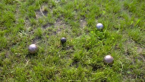 top view of pentanque balls on the grass in the park