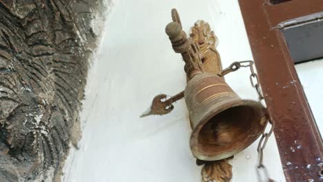 close up ringing the house bell