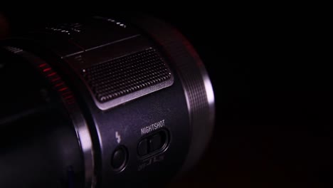 moving adjustment rings on the video camera lens in the dark