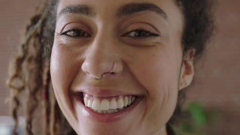 close-up-portrait-of-beautiful-mixed-race-woman-face-smiling-cheerful-happy-looking-at-camera-wearing-nose-ring