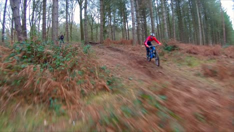cable cam following a mountain bike down a trail at cannock chase
