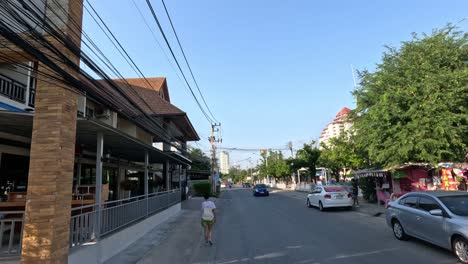 progression of a vehicle moving down a bustling street