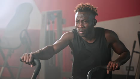 man working out on exercise bike