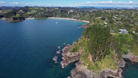 mawhitipana bay and coastline of palm beach on sunny day in auckland, new zealand