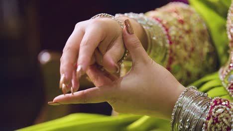 A-lovely-Balochi-bride-from-Pakistan-donning-her-stunning-silver-bracelet,-close-up-shot