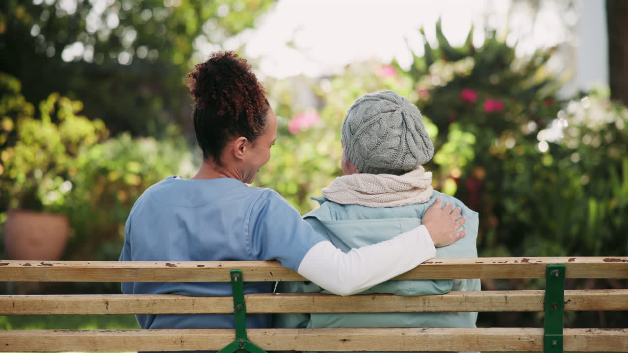 Caregiver and Senior Woman on Bench
