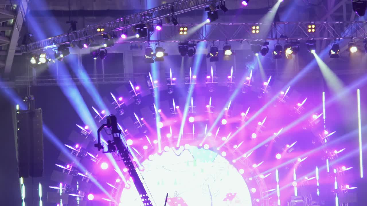 Crane jib camera moves in front of stage lights