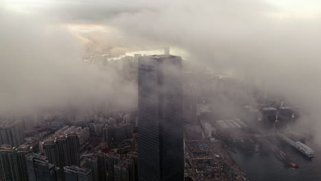 modern skyscraper icc partly covered in clouds