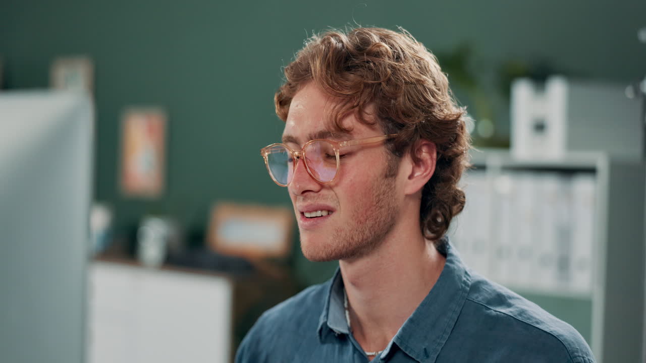 Tired man with headache in office
