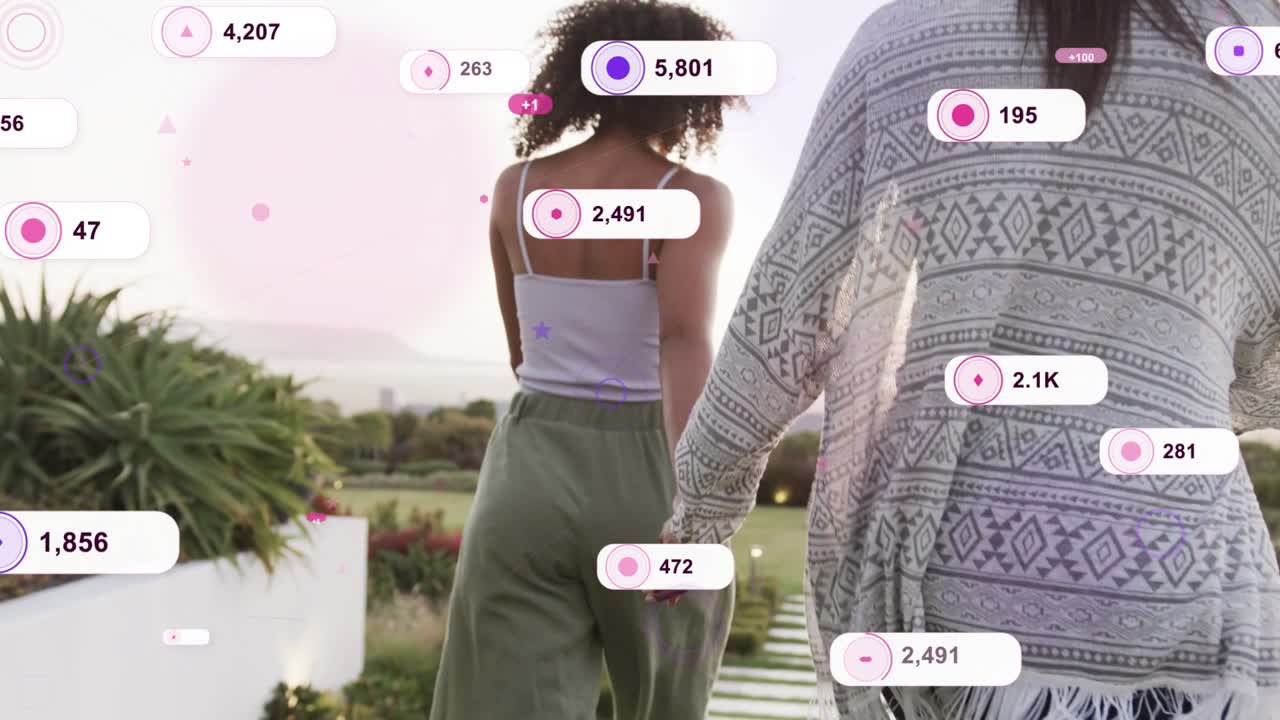 Two women walking holding hands on sunset lawn, metric badges multiplying around them for marketing