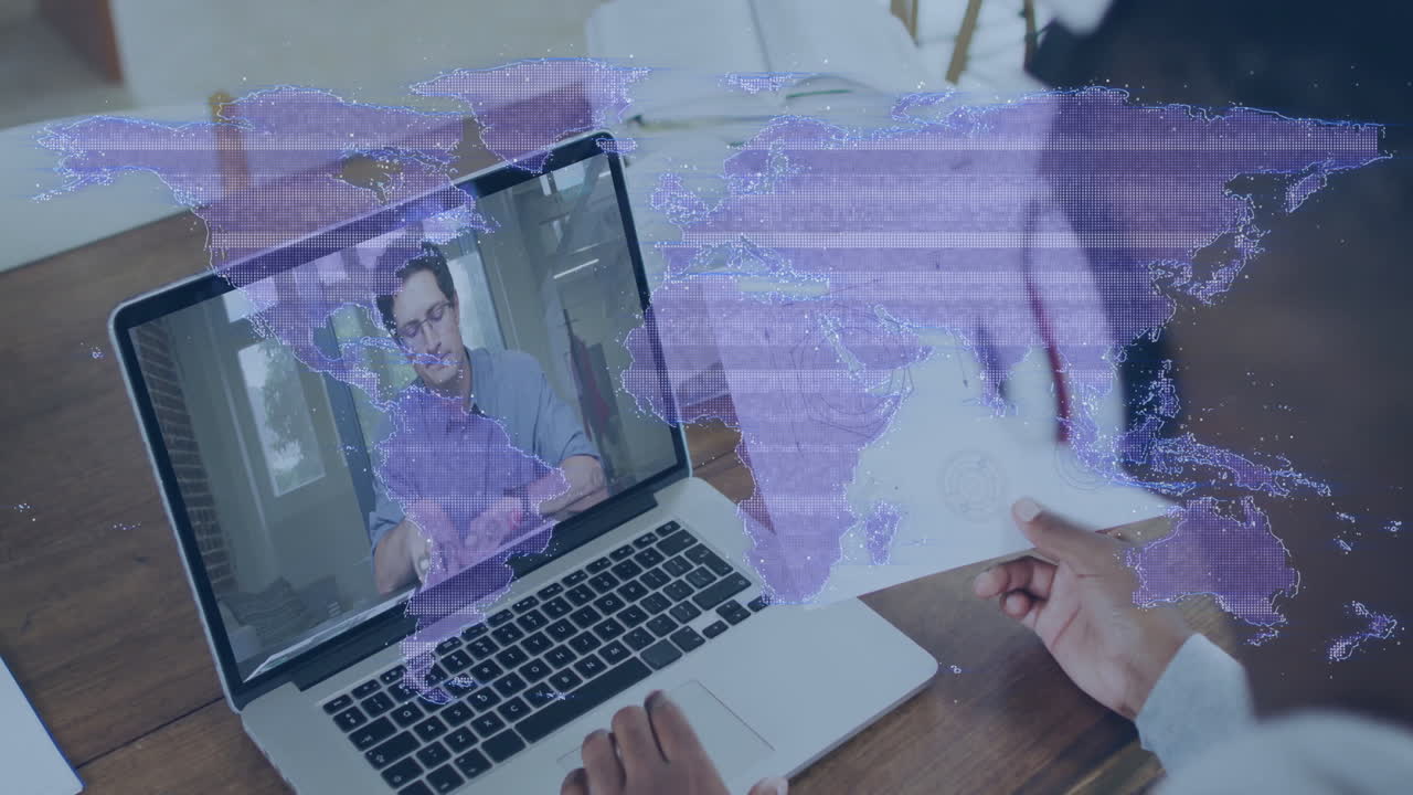 World map animation over person video conferencing on laptop at home