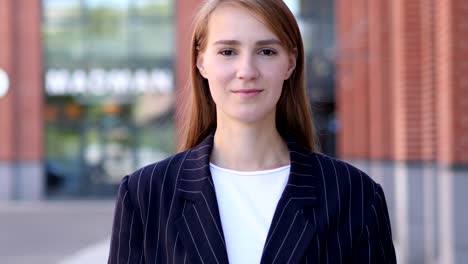 portrait of serious business woman looking at camera