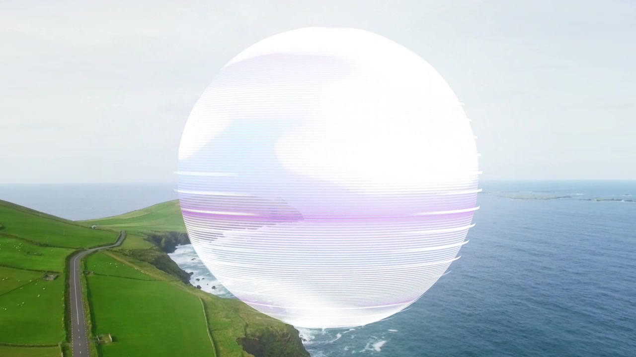 Sfera che appare sopra una scogliera, che scansiona la costa con linee di scansione pulsanti per la visualizzazione tecnologica.