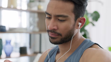 Fitness-man-reading-time-on-watch-with-music