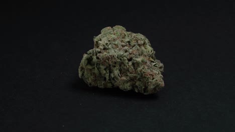 Cannabis-or-marijuana-bud-rotating-on-black-background,-Closeup-Studio-Shot