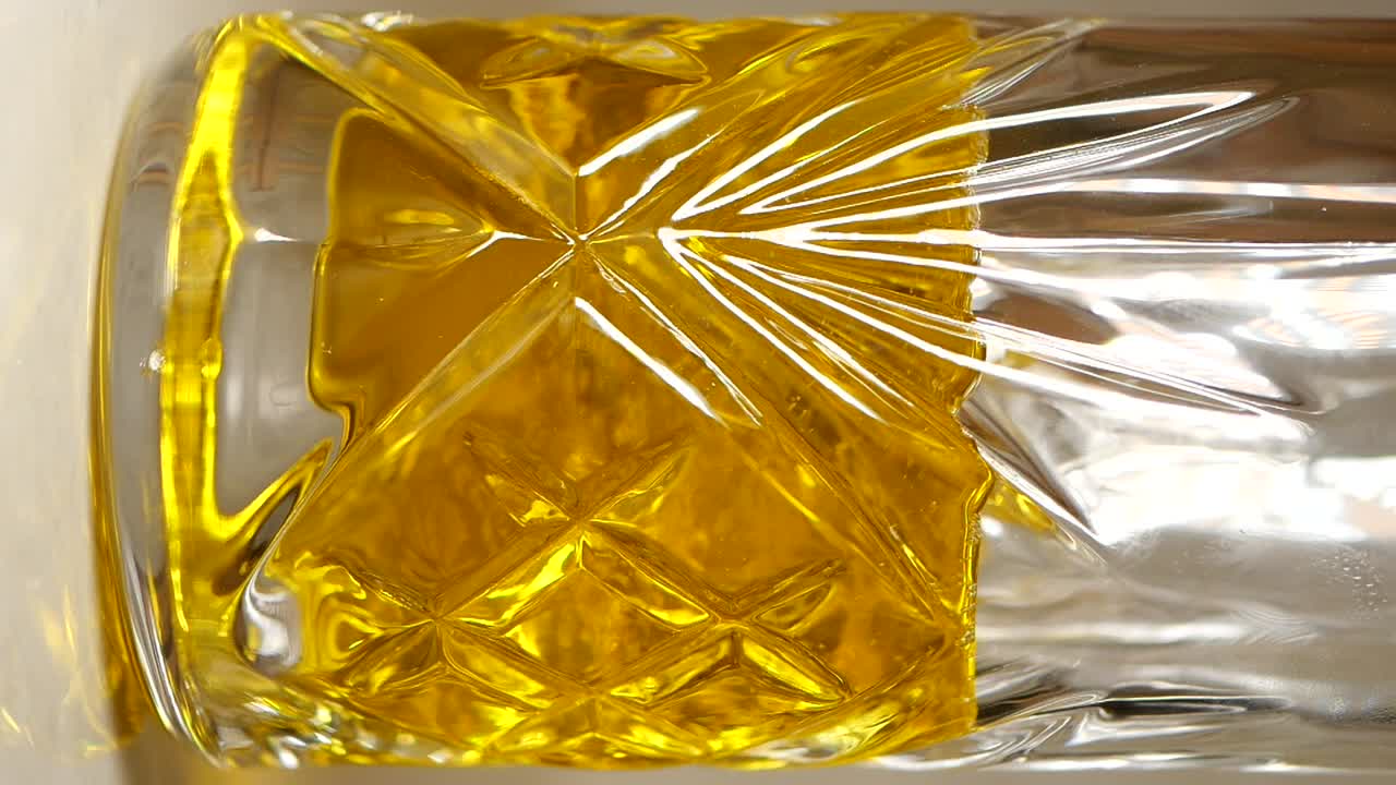 Glass with Yellow Liquid