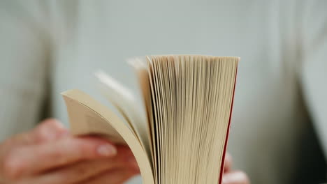 person reading a book closeup