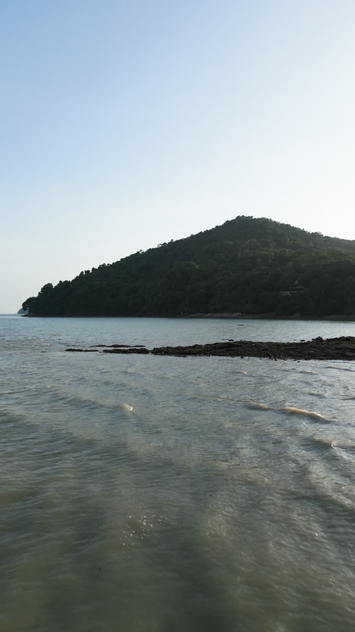 Coastal landscape with mountain and water