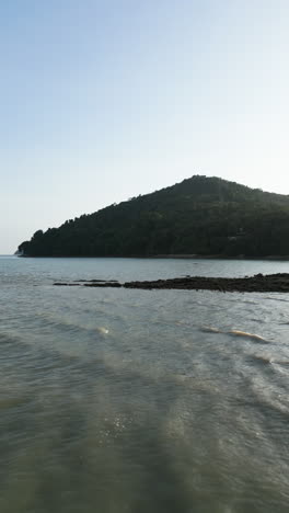 coastal landscape with mountain and water