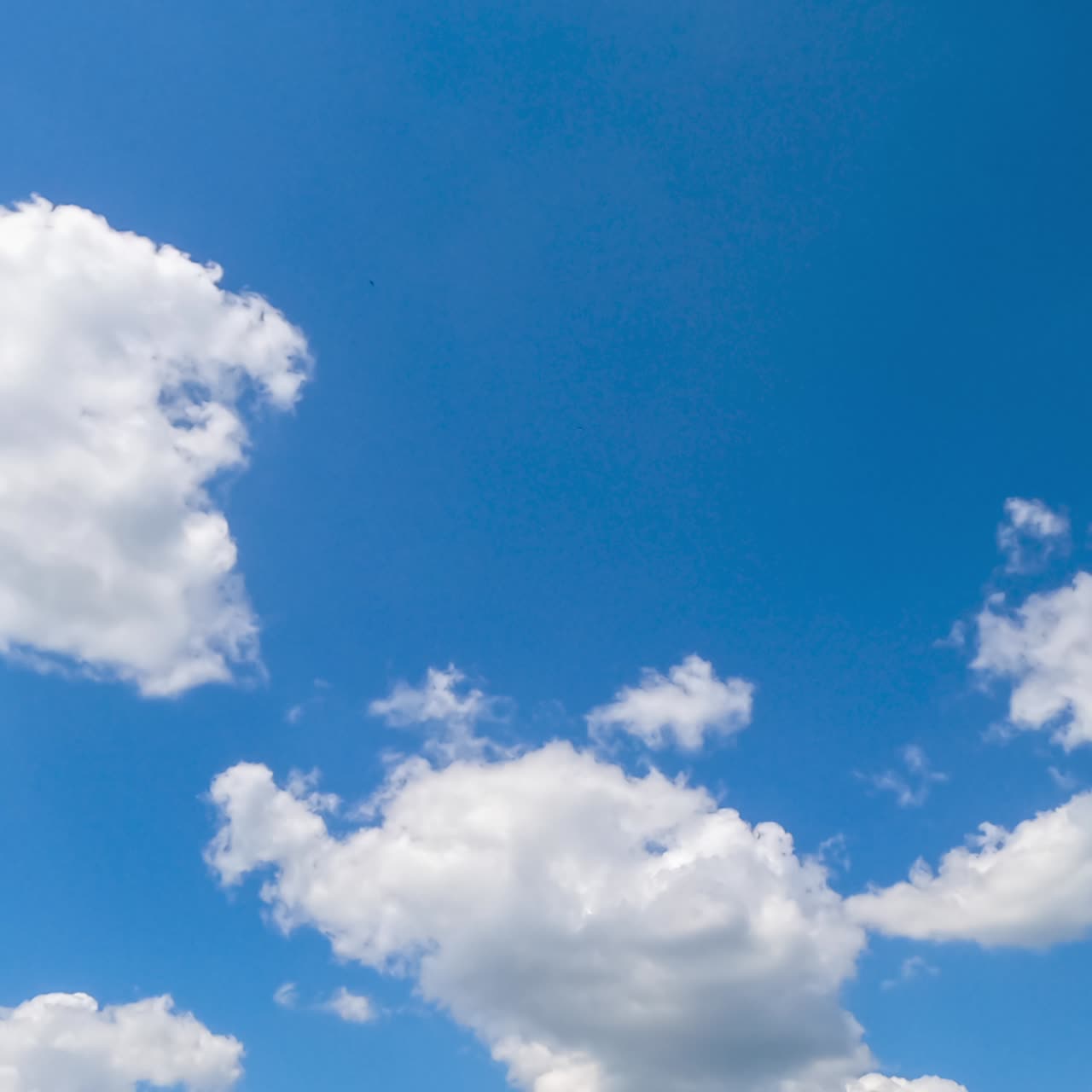Amazing blue summer sky with beautiful clouds. White cumulus clouds at midday sunshine day timelapse