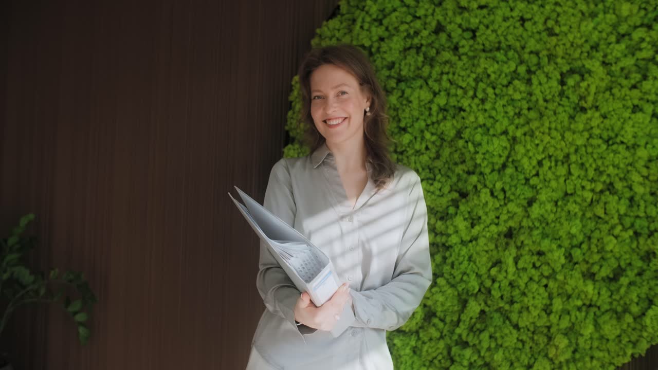 Woman with Documents in Modern Office